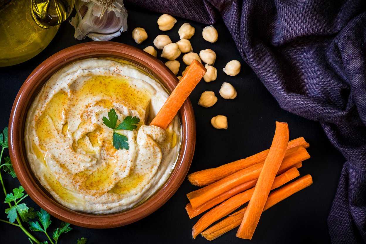 Homemade hummus with carrot sticks